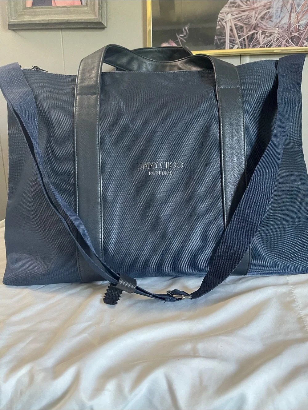 Large navy travel duffel from Jimmy Choo Parfums Durable fabric with leather